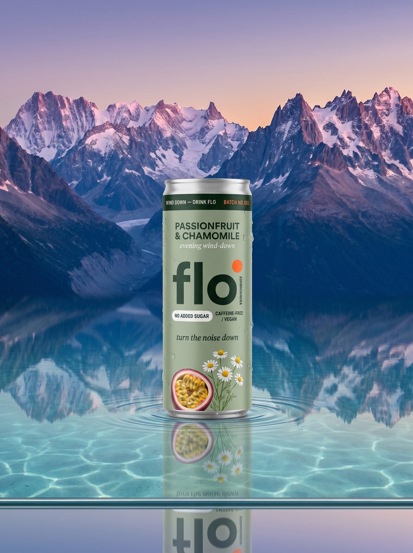 Calm Core can floating between dusk-lit mountains and a glassy turquoise lagoon